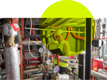 Inspector checking HVAC installation for plumbing code compliance with condensate neutralizer systems.
